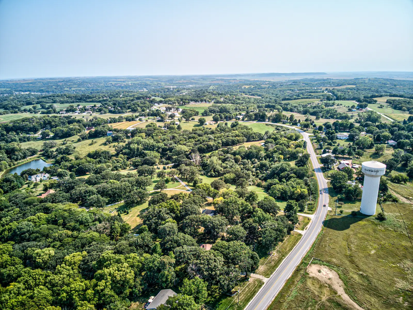 Aerial view of rolling farmland and acreage in Mills County, Iowa near Glenwood